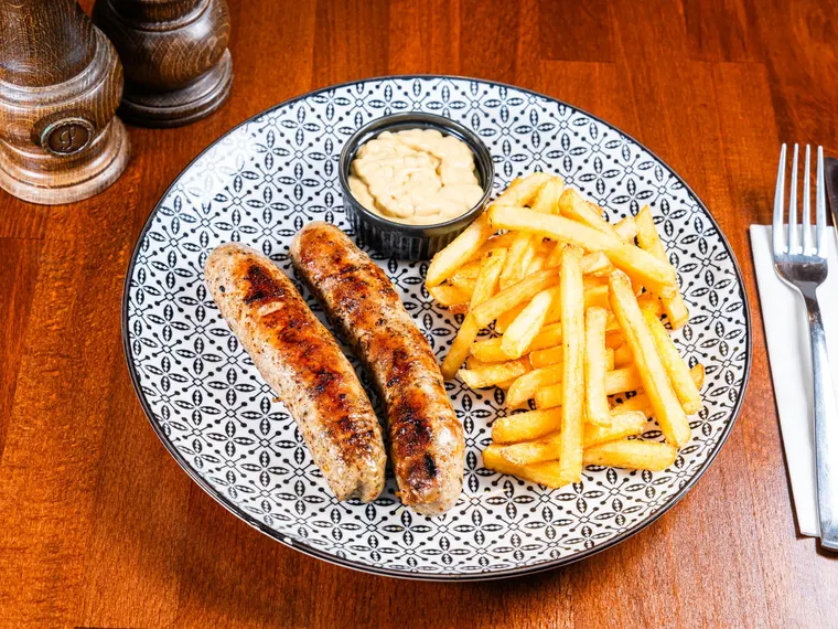A plate of cârnați oltenești (oltenian grilled sausages), at Ciorbe La Ion