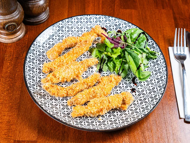 A plate of chicken fingers (our own recipe), at Ciorbe La Ion