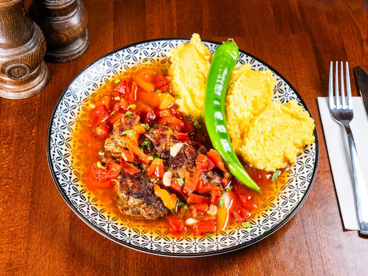 A plate of saramură (brine-grilled) carp fillet, galați style, at Ciorbe La Ion